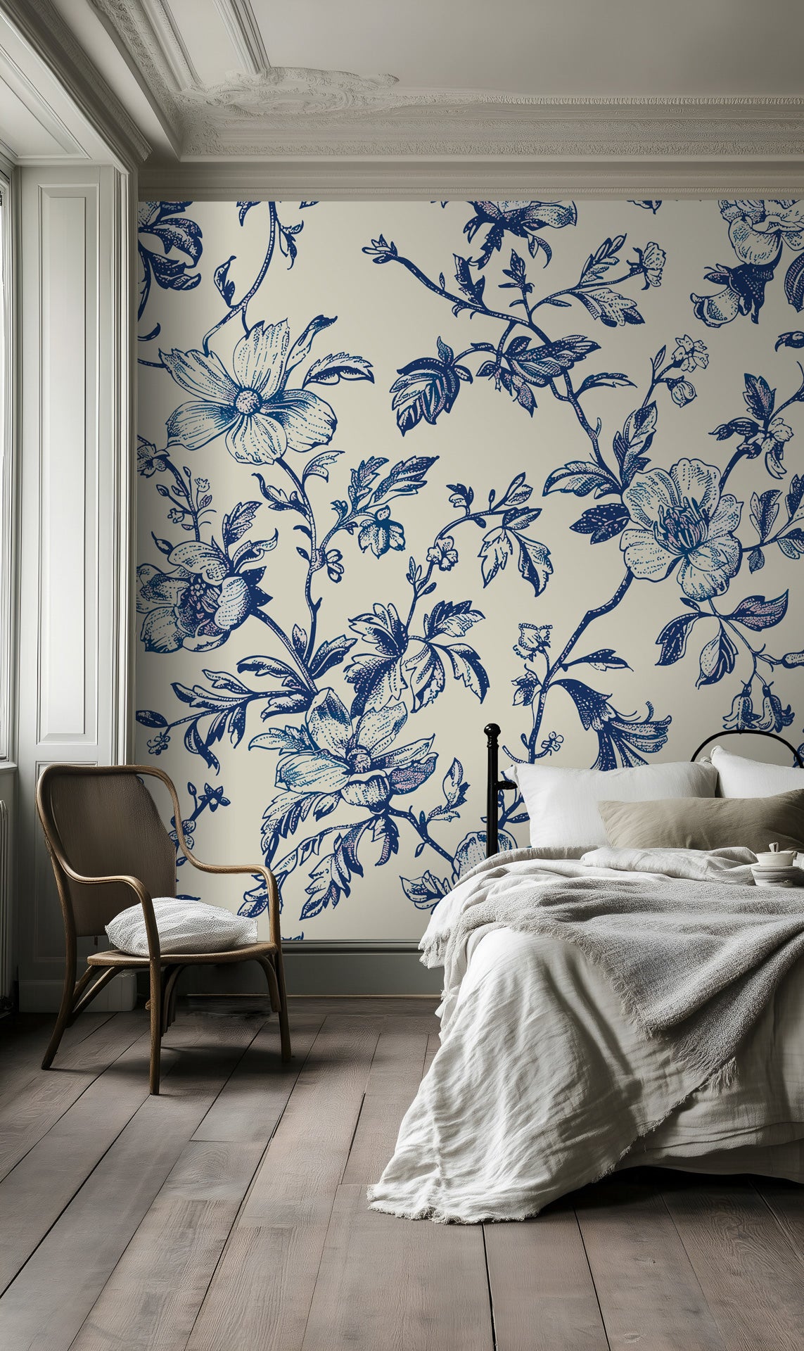 Vintage blue floral wallpaper on a bedroom wall, creating an elegant and timeless interior with classic botanical charm.