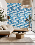 Removable self-adhesive wallpaper featuring a marine blue and white undulating wave design