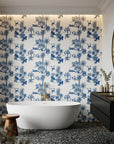 Azure Palms blue tropical jungle toile wallpaper creating ambiance in a serene bathroom