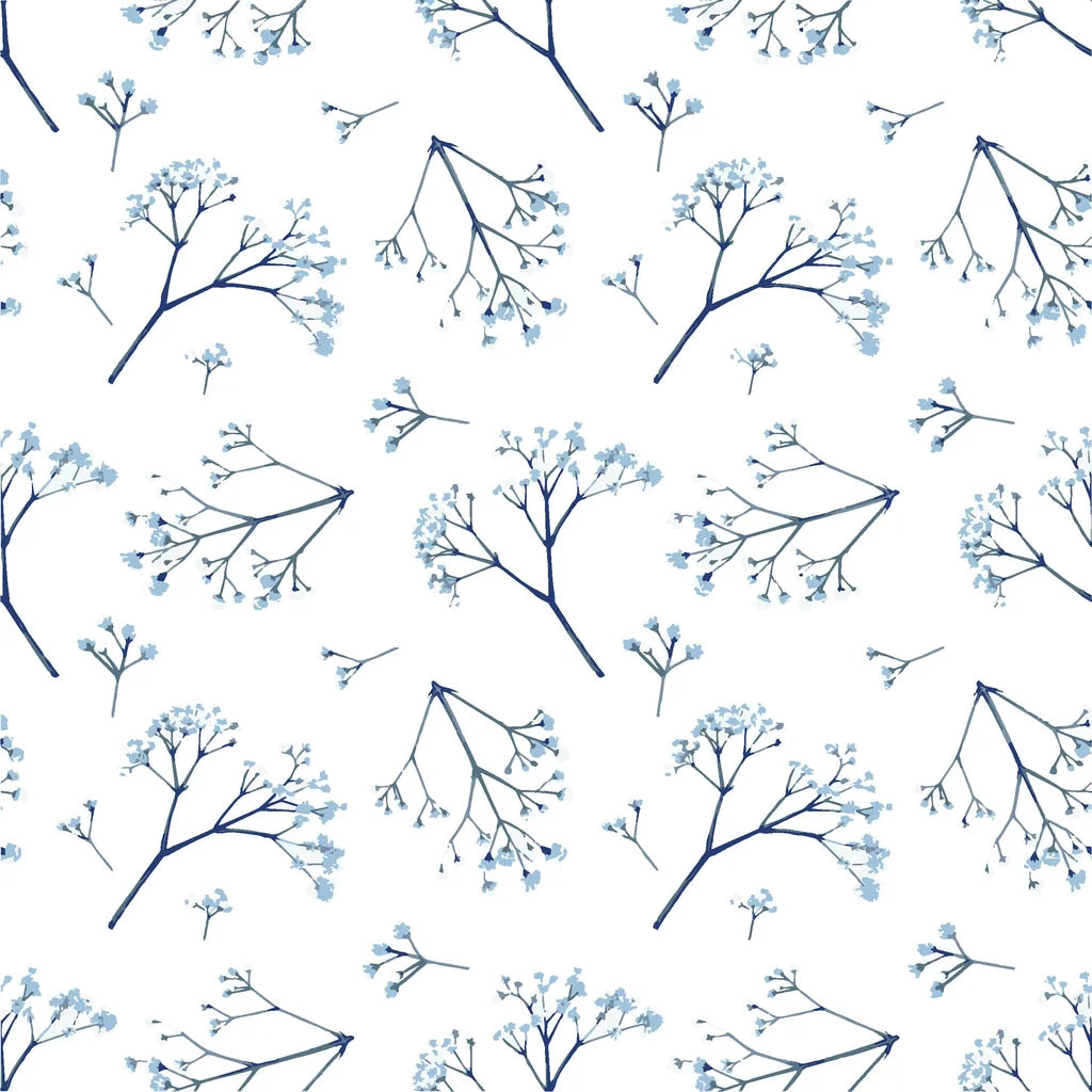 Grey and blue foliage accents against a pristine white surface.