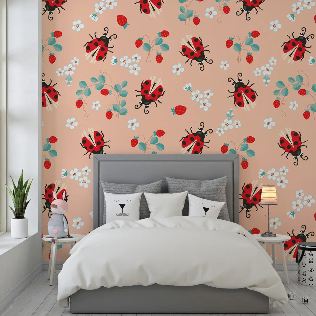 Elegant botanical wall covering featuring soft peach tones, delicate ladybugs, and ripe strawberries with a smooth adhesive finish. - Berry Wings