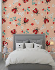 Elegant botanical wall covering featuring soft peach tones, delicate ladybugs, and ripe strawberries with a smooth adhesive finish. - Berry Wings