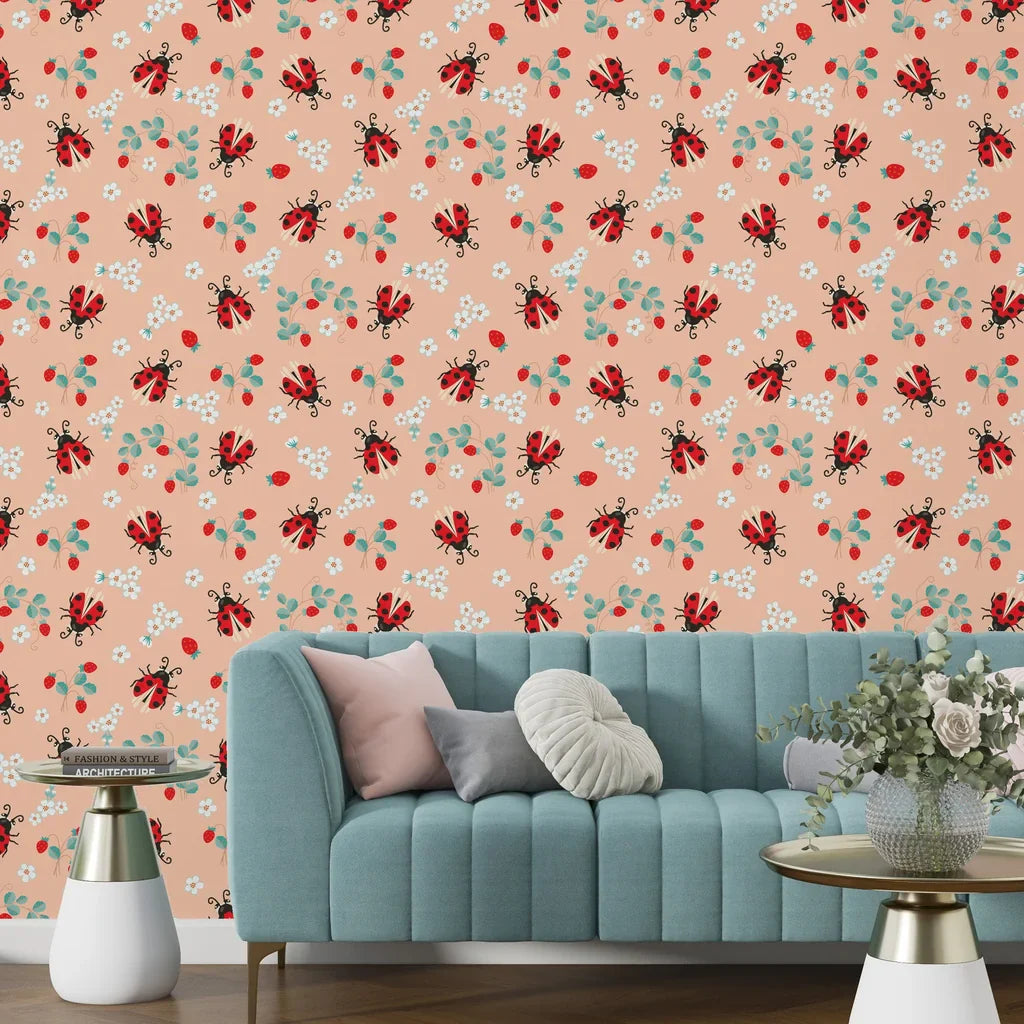 Pastel orange floral wallpaper with a smooth texture displaying a whimsical ladybug and strawberry motif. - Berry Wings