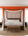 Blazing Petal bold red hibiscus wallpaper adding character to a cozy bedroom