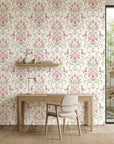 Blossom Reverie pink floral damask wallpaper as a feature wall in a bright home office