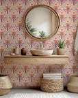 Bohemian style removable wallpaper featuring arches of palm leaves in soft pink and lush green