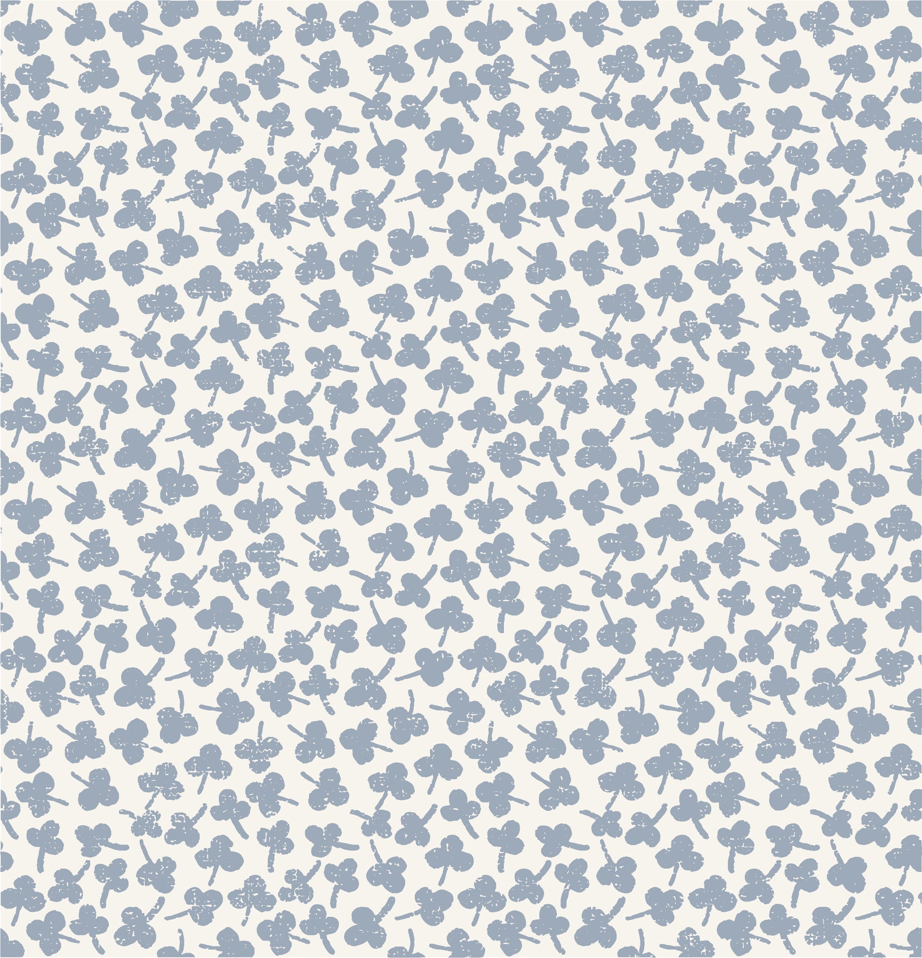 Soft porcelain blue floral wallpaper with small hand stamped blossoms scattered across a warm ivory background.