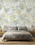 Blue Fossil distressed botanical peel and stick wallpaper in a warm and inviting living room