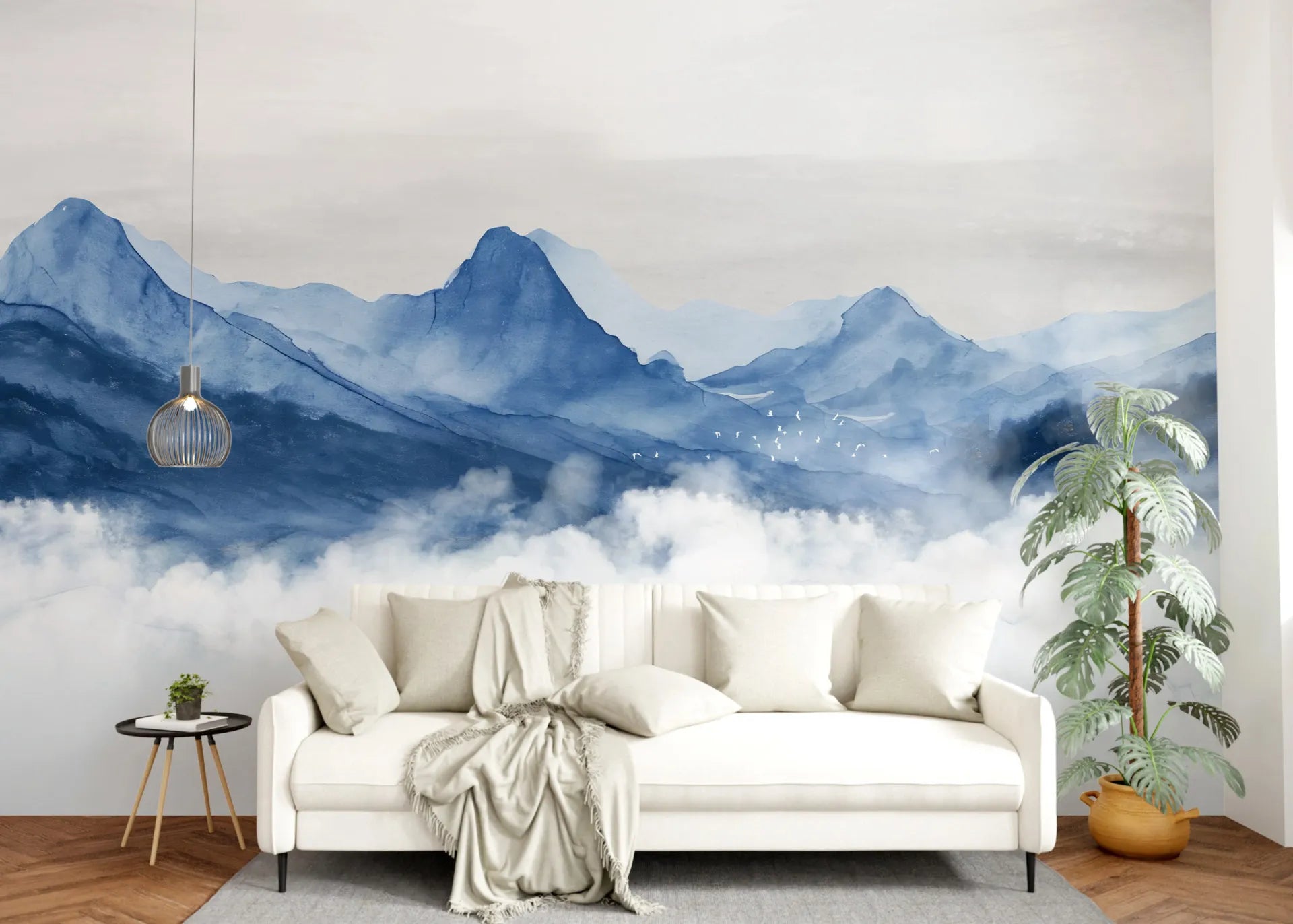 Blue Mountains watercolor mural wallpaper with misty peaks and clouds in modern living room