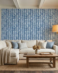 Blue Stitching navy and white chevron herringbone wallpaper in a warm and inviting living room