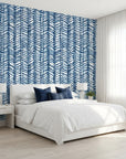 Blue Stitching navy and white chevron herringbone wallpaper adding character to a cozy bedroom