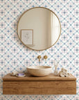 Blue Talavera pink and blue floral peel and stick wallpaper adding character to a cozy bedroom