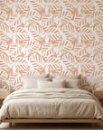 Blush Frond peach botanical peel and stick wallpaper adding character to a cozy bedroom