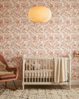 Blush Frond peach botanical peel and stick wallpaper bringing warmth to a peaceful nursery