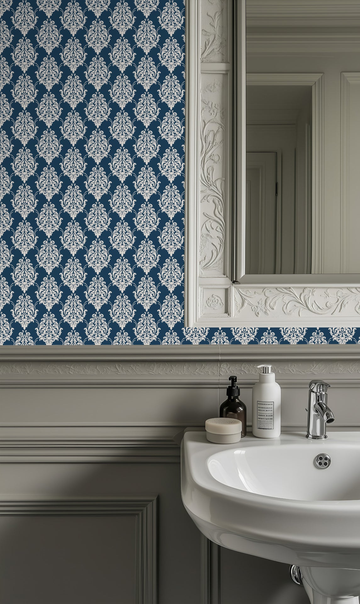 Classic damask wallpaper with crisp ivory ornamental scrollwork on a deep teal blue background.