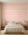 Blush Ikat peach and pink abstract wallpaper in a warm and inviting living room