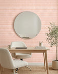 Blush Ikat peach and pink abstract wallpaper creating ambiance in a serene bathroom