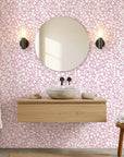 Blush Silhouette pink floral peel and stick wallpaper creating ambiance in a serene bathroom