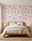 Blush Tropics pink botanical peel and stick wallpaper in a warm and inviting living room