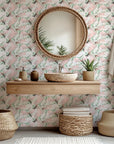 Pink and green watercolor paint splatters decorate this abstract wallpaper design called Blush Thicket