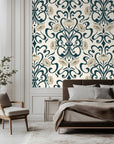 Ornate art nouveau floral wallpaper with flowing dark teal scrollwork and soft ivory blossoms on a porcelain cream background.