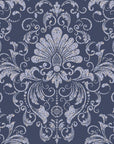 Vintage damask wallpaper with distressed ivory scrollwork and ornate floral motifs on a deep navy blue background.