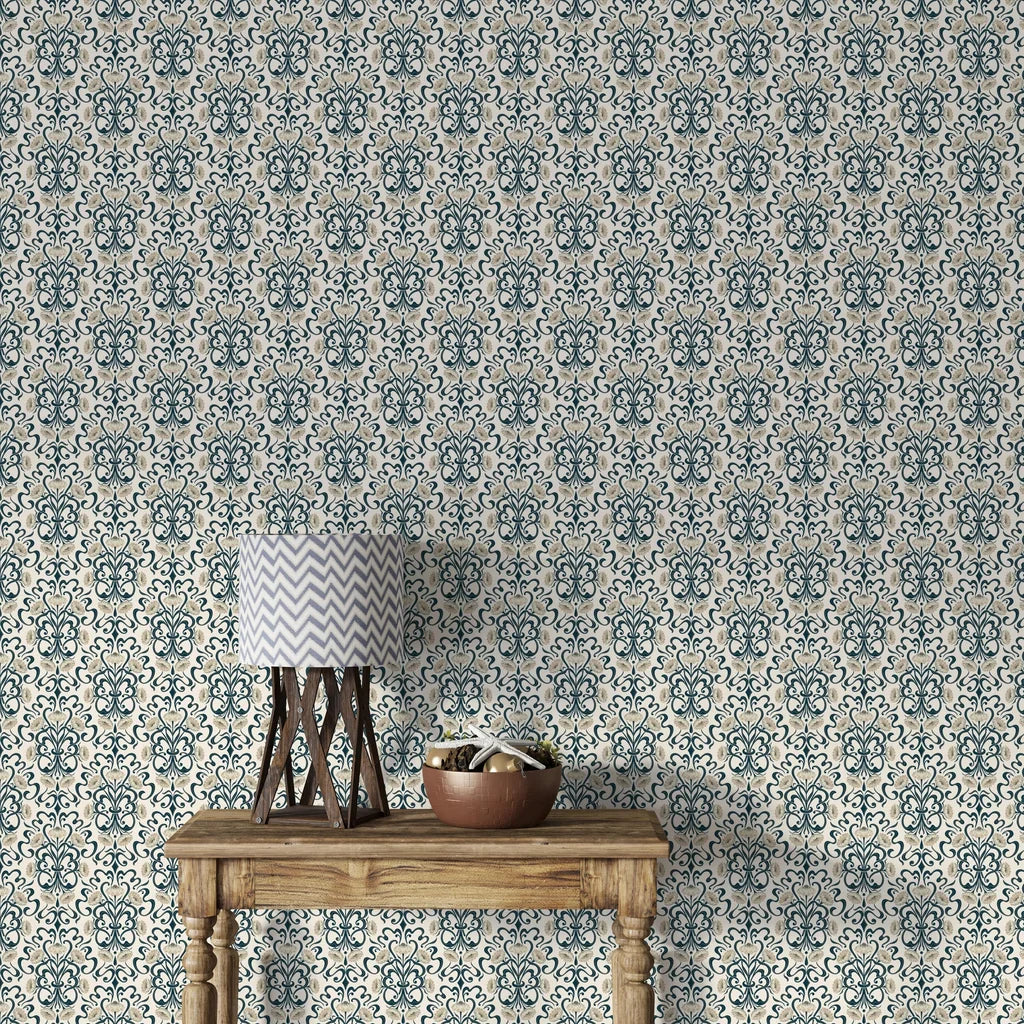 Highly detailed floral wallpaper in the Art Nouveau style, comprised of undulating dark teal scrollwork and clusters of soft ivory blossoms set against a porcelain cream field