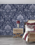 Navy and silver Blushed Whisper damask wallpaper on bedroom accent wall with ornate scrollwork pattern
