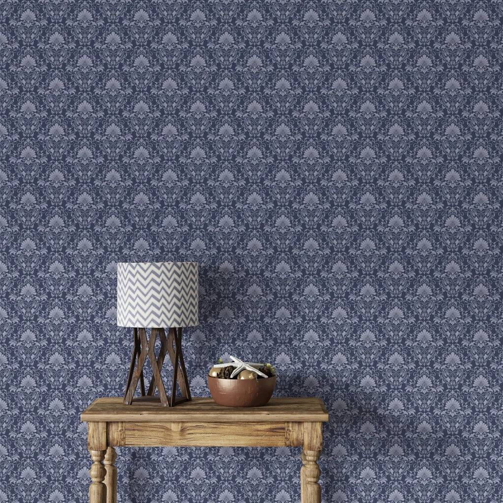 Navy and silver damask Blushed Whisper wallpaper with ornate floral medallions in styled living room