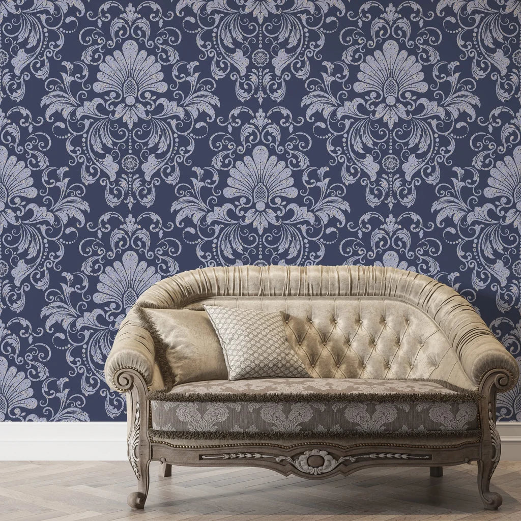 Navy and silver Blushed Whisper damask wallpaper behind elegant tufted sofa in luxury living room