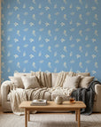 Borrowed Blue serene blue botanical sprig wallpaper in a warm and inviting living room