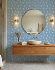Borrowed Blue serene blue botanical sprig wallpaper creating ambiance in a serene bathroom