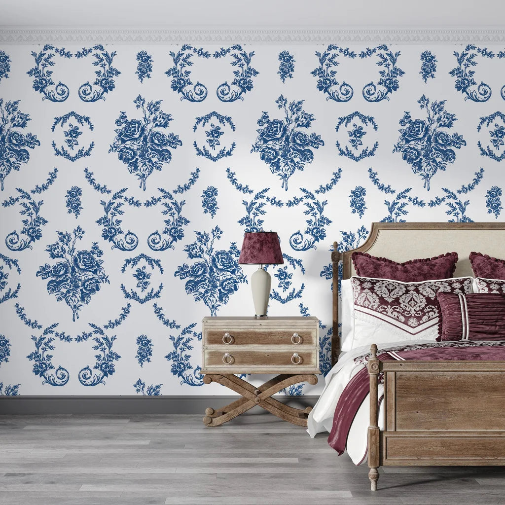 Blue and white Botanica Grace damask wallpaper with ornate floral medallions in elegant bedroom setting