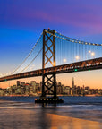 Bridges To Forever wallpaper featuring illuminated suspension bridge at dusk with blue and orange gradient sky