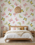 Bubblegum Flutter pink and yellow butterfly wallpaper adding character to a cozy bedroom