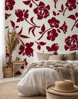 Burgundy Bloom peel-and-stick wallpaper featuring a floral silhouette design against a cream backdrop