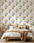 Buttercup Meadow yellow floral wallpaper adding character to a cozy bedroom