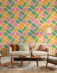 Candy Cobbles colorful retro geometric brick wallpaper in a warm and inviting living room