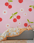 Retro-inspired geometric wallpaper featuring vibrant red cherries and crisp white daisy motifs - Candy Bloom