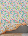An abstract array of multicolored dotted arcs forms a contemporary removable wallpaper pattern. - Candy Currents