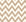 Caramel Drip taupe & gold geometric wallpaper creating ambiance in a serene bathroom