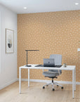 Caramel Haze cozy caramel brushstroke dot wallpaper as a feature wall in a bright home office