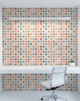 Carnival Cloth vibrant multicolor polka dot wallpaper as a feature wall in a bright home office