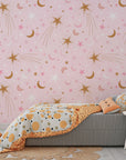 Self-adhesive wall mural with metallic gold astronomical motifs over a pastel pink background - Celestial Blush