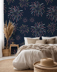 Dark blue wall covering, adorned with bursts of yellow and pink fireworks
