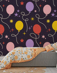 Removable wall covering in dark navy blue adorned with festive balloon patterns and twinkling golden stars - Celestial Bloom
