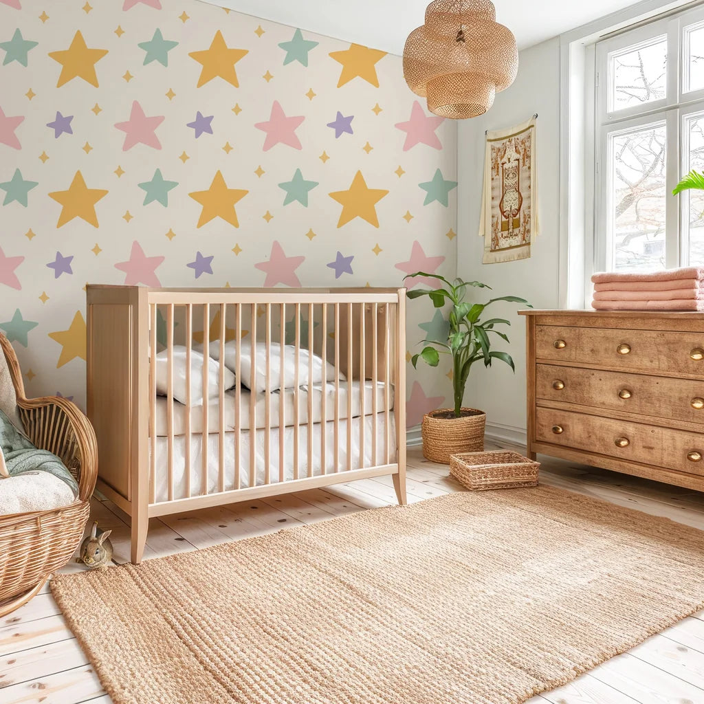 Peel-and-stick wall covering in a cream hue featuring a pattern of soft, multi-hued stars and glinting celestial details. - Celestial Dream