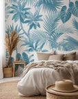Thick, layered tropical foliage saturated in rich cerulean blue