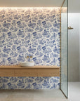Cerulean Estate classic blue toile landscape wallpaper creating ambiance in a serene bathroom