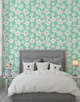 Self-adhesive wallpaper featuring white crayon-style daisies over a soft mint green backdrop. - Chalky Meadow